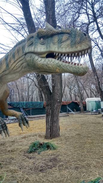 istock model of a dinosaur in a city park 2183963976