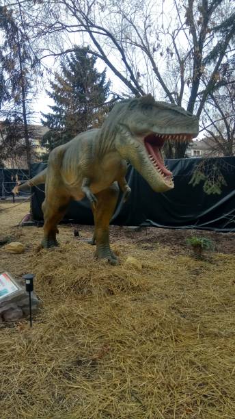 istock model of a dinosaur in a city park 2183964005