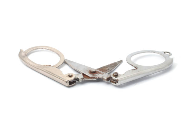 istock Closed scissors in a flat, folded position with the handles visible on a white background. 2183964652