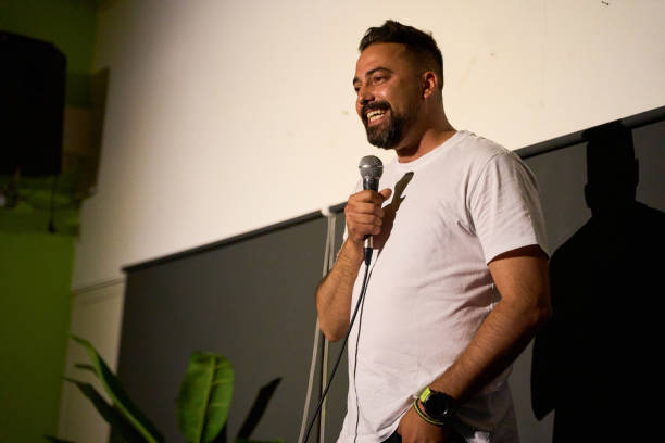 istock Male performer delivering a monologue on stage in an alternative theater with audience 2183964832