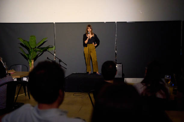 istock Female performer delivering a monologue on stage in an alternative theater with audience 2183965020