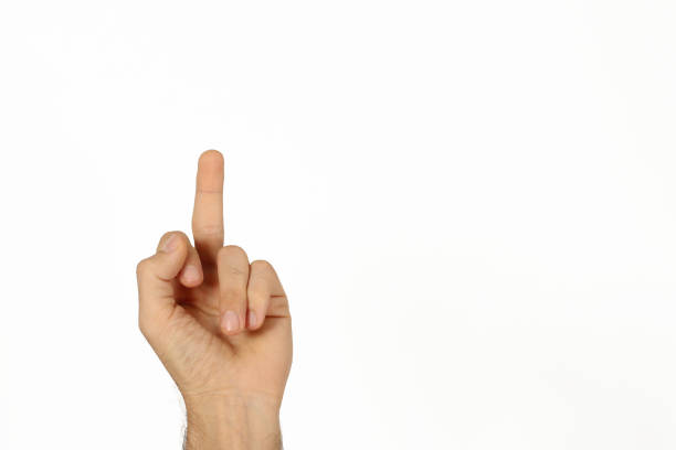 Isolated on white background. A male hand with a raised middle finger.