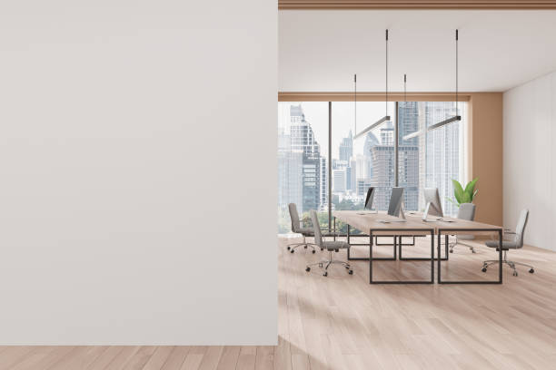 istock Modern office space with empty wall and desk setup for mockup purposes. 3D Rendering 2183969335