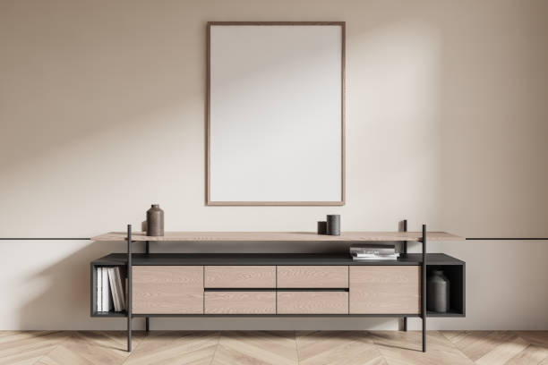 istock Empty poster mockup on a beige wall above a wooden cabinet with decor. 3D Rendering 2183969373
