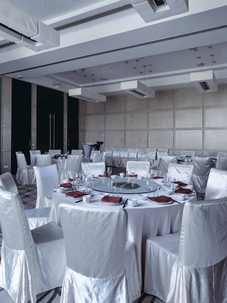 istock A high-end restaurant interior with neatly set tables draped in white tablecloths 2183969899