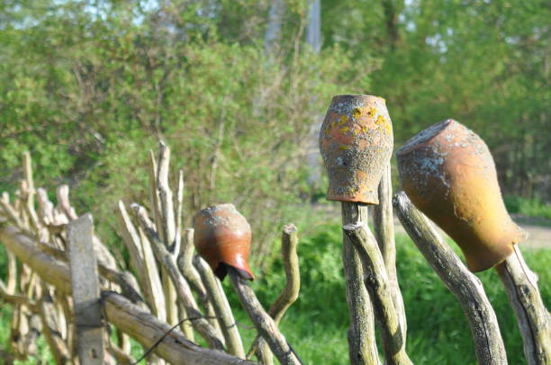 istock Clay vases hang on the fence 2183973300