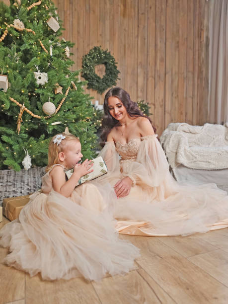 istock mother and daughter unpack Christmas presents 2183979706