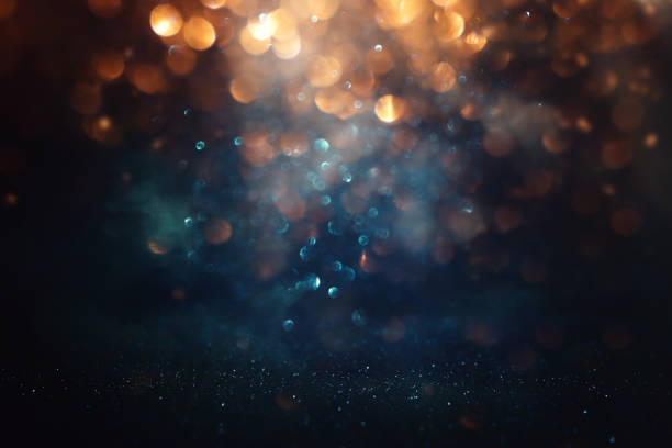 istock abstract glitter black, gold , blue lights background. de-focused 2183981290