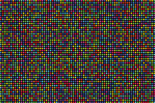 Countless small circles of different colors randomly arranged on  black background