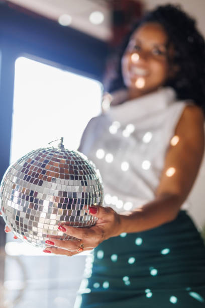 istock Charming woman holding a disco ball 2183982533