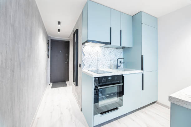 istock Loft Scandinavian Style Cozy Modern Minimalism Open Bright Kitchen Home Interior. Faucet, Fridge, Oven, Closet and Furniture in Background. LED Light 2183982721