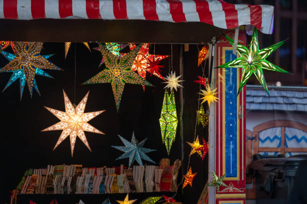 istock Colorful Decorative Stars at Night Market 2183983239