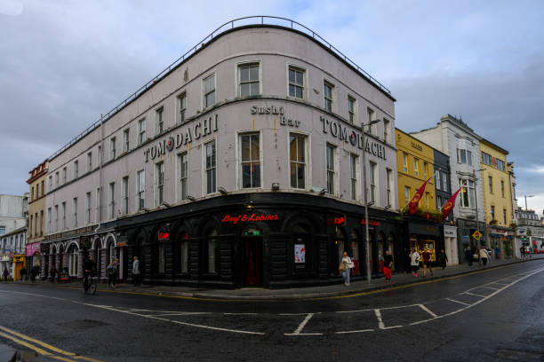 People hanging around the famous Temple Bar in Dublin, Ireland
