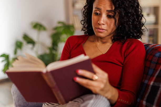 istock Simply relaxing on the sofa and reading a good book 2183985538
