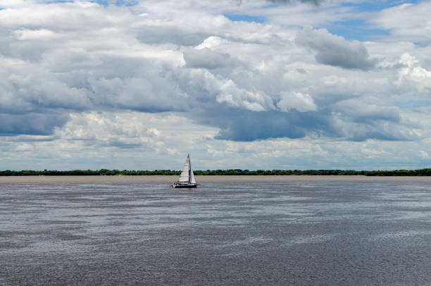 Ship sailing on the river during the day