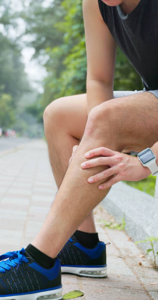 istock asian man sporting calf cramping 2183988136