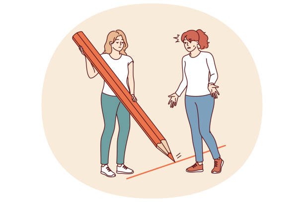 istock Woman draws boundary and prohibits crossing it, using large pencil to draw red line 2183990922