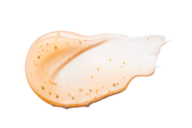 istock Orange body or face or scalp scrub gel with polymer particles, salt or sugar sample swatch isolated on white 2183992510