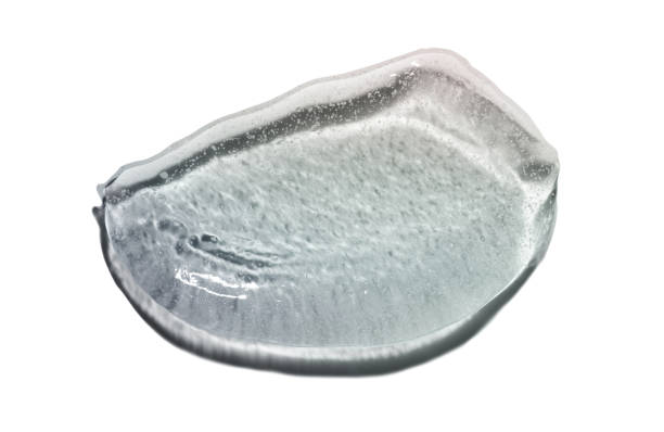 istock Body or face or scalp scrub gel with polymer particles, salt or sugar sample swatch isolated on white 2183992849