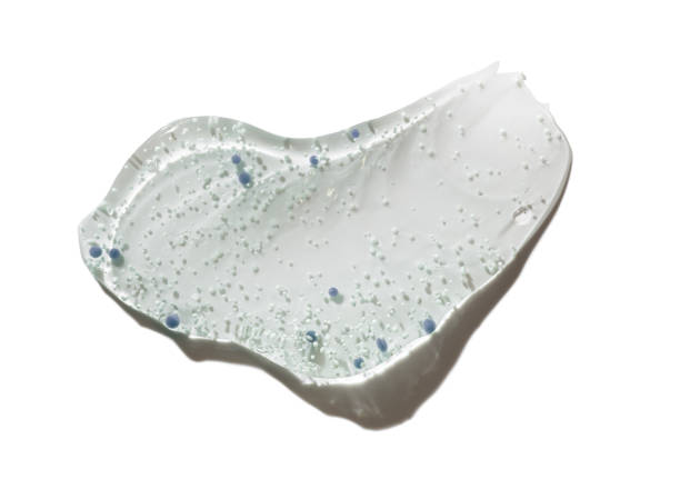 istock Body or face or scalp scrub gel with polymer particles, salt or sugar sample swatch isolated on white 2183992979