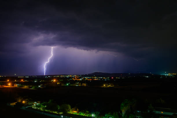 Extreme storm over the ocean with heavy rain, lightning and dark dramatic clouds. Extreme weather scene in Australia.