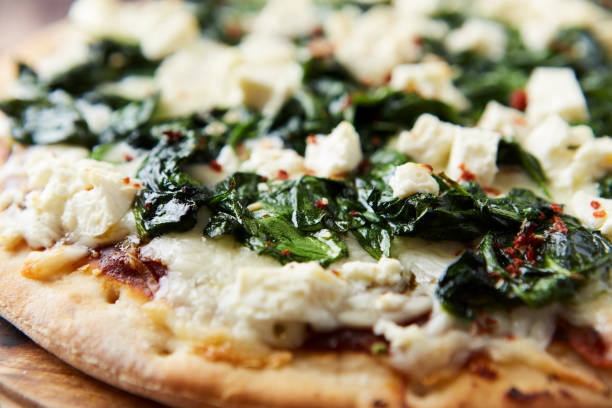 istock Pizza with mozzarella cheese and spinach. Dark wooden background. Close up. 2183997504