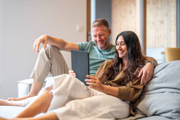 istock Caucasian Couple Engaging with Tablet in Home Setting 2184003213