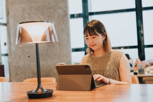 istock Asian chiense  girl working witha latpop  and seeking for advice from AI assistant on a mobile app 2184006584