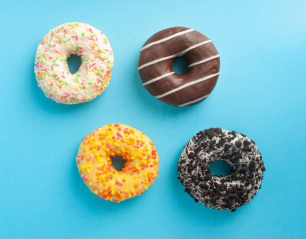 istock Doughnuts, Chocolate Brown and Pink Donut with Multicolored Sprinkles 2184009400