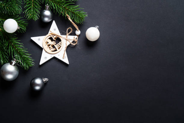 istock Black christmas background. Christmas present with golden decorations 2184013742