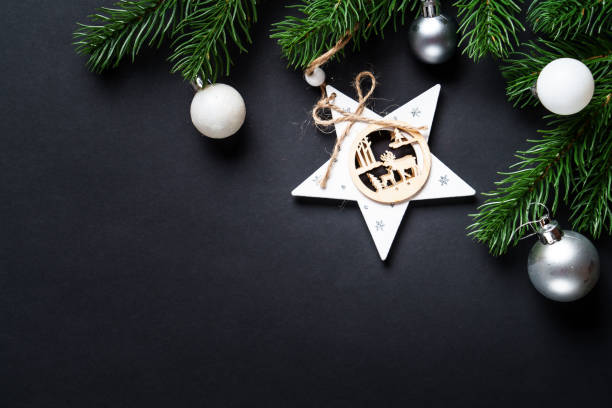 Black christmas background. Christmas present with golden decorations