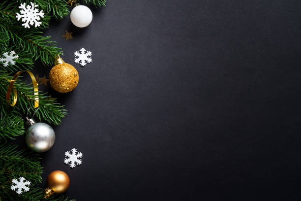 istock Black christmas background with holiday decorations, elegant modern style. 2184013882