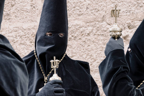 Zamora, Spain, March 29th, 2024: Solemn Procession: Penitents in Traditional Attire during Zamora's Holy Week