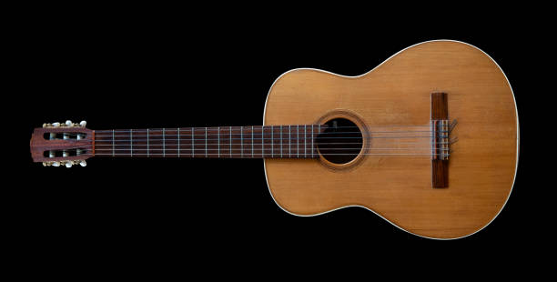 Classical vintage acoustic guitar isolated on black background