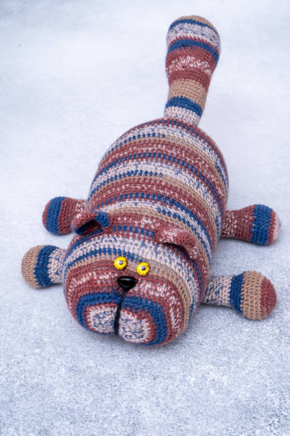 istock Crocheted toy cat. Melange thread. Hobby: knitting. Funny animal. 2184040459