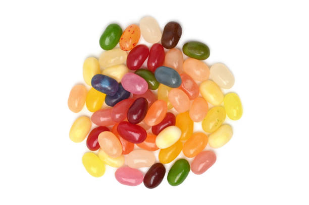Colorful fruity jelly beans on white background