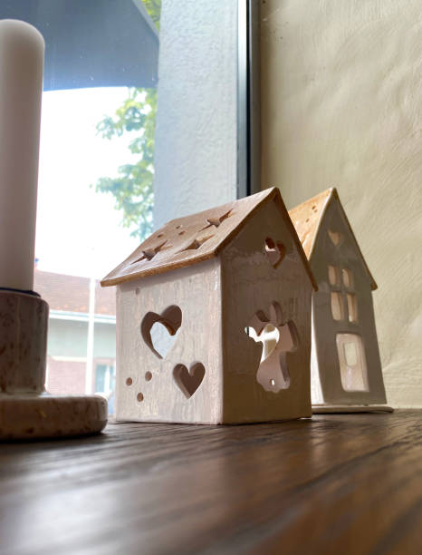 istock a small house on the windowsill as a decoration 2184045329