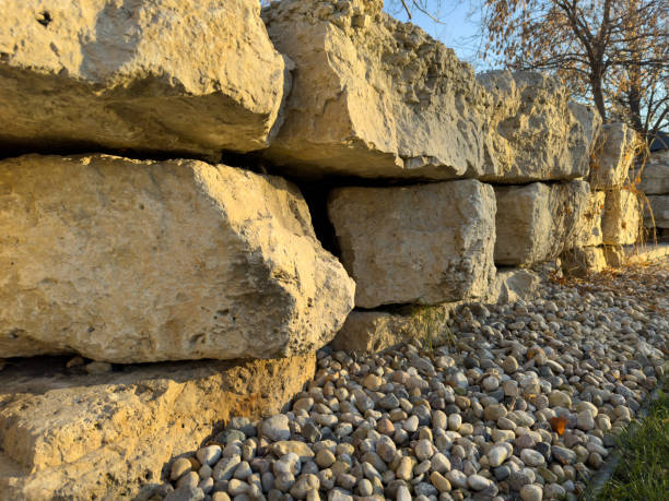 retaining wall made of large yellow stones natural stone texture