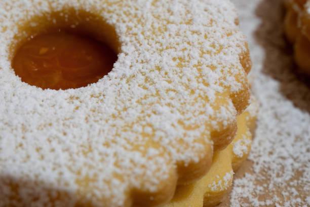 istock Close-up of powdered sugar cookie with jam filling 2184049973