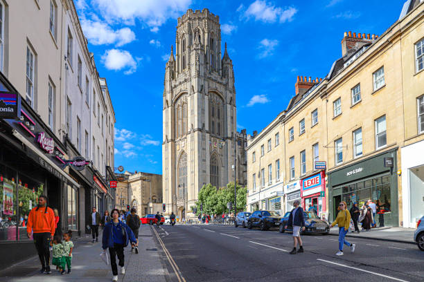 September, 2024. Bristol, United Kingdom. Street view in the center of the city with various persons and a historic building.