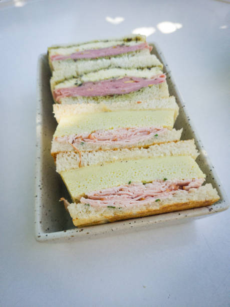 istock Gourmet tea sandwiches with ham and cheese on a plate 2184055985