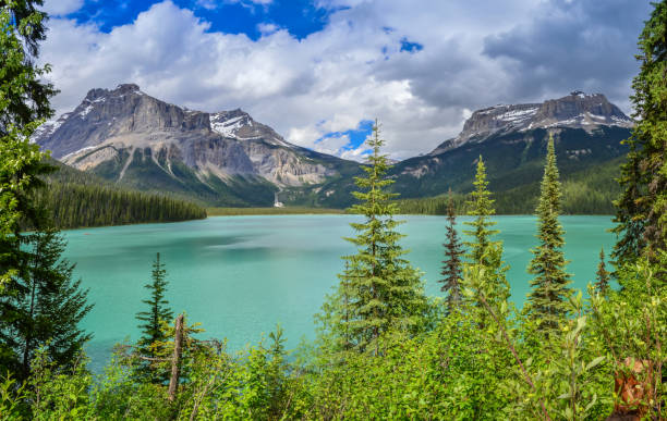 istock Stunning Mountain Lake View with Pine Forest and Blue Sky 2184059053