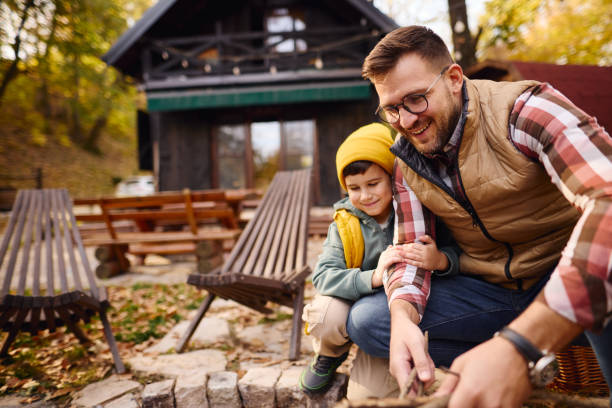 istock Father and Son Enjoying Outdoor Activity Together at Cabin 2184061068