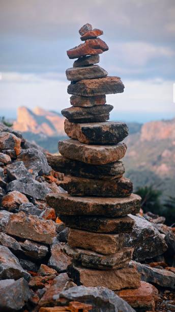 istock Mountain Cairn with Rocky Landscape Background 2184065921