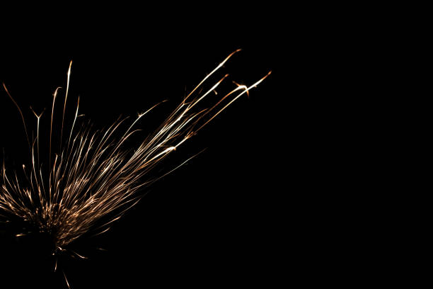 sparks from the grinder glowing in the dark