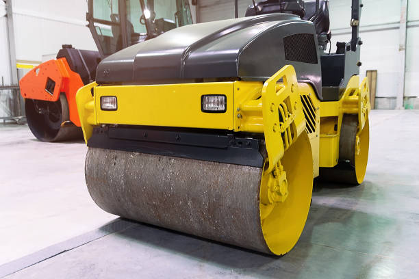 istock The yellow road roller is in the hangar. Construction industry 2184068863