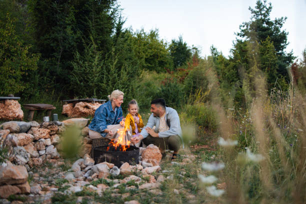 istock Family Enjoying a Cozy Campfire in Nature Setting 2184069220