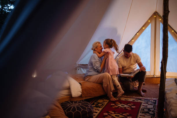 istock Family Enjoying Quality Time Glamping in Cozy Tent Setting 2184069229