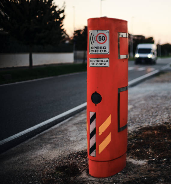 Italy - A bright orange roadside speed monitoring device marked with \