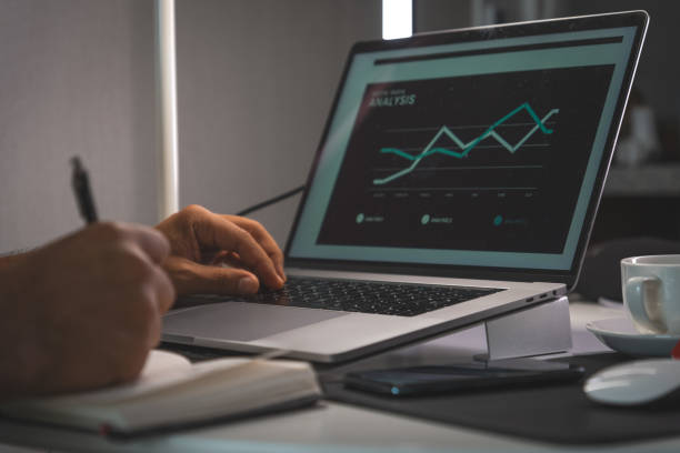 istock A man is writing on a laptop with a pen 2184072390